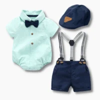 Baby boy mint green formal outfit set with bow tie, suspenders, navy shorts, and matching cap, displayed for catalog.