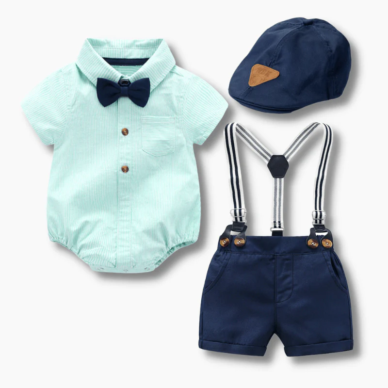 Baby boy mint green formal outfit set with bow tie, suspenders, navy shorts, and matching cap, displayed for catalog.