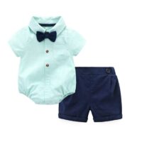 Baby boy mint green formal outfit set with bow tie, suspenders, navy shorts, and matching cap, displayed for catalog.