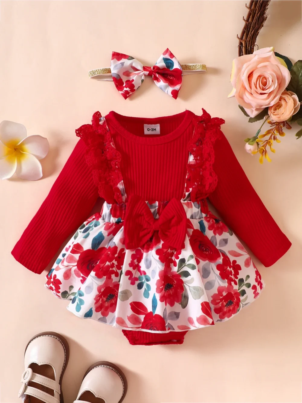Baby girl red floral dress set with ribbed bodice, lace detailing, waist bow, floral skirt, and matching headband, displayed for catalog.