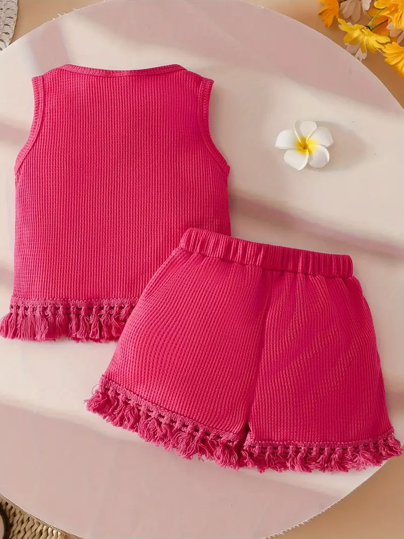 Girls summer outfit set with sleeveless top and matching shorts, displayed for catalog
