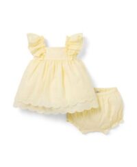 Baby girl bloomers dress set with sleeveless dress, ruffled straps, scalloped hem, and matching bloomers, displayed for catalog.