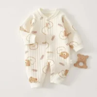 Long sleeve baby onesie with snap closure, soft fabric, and playful printed design, cozy clothing for infants.