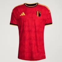 Belgium_26_Home_Authentic_Jersey_Red Front studio flat-lay view of the ared Belgium 2026 home football jersey with an all-over flame pattern and gold logos — Tsapa Rwanda Premium Sportswear.