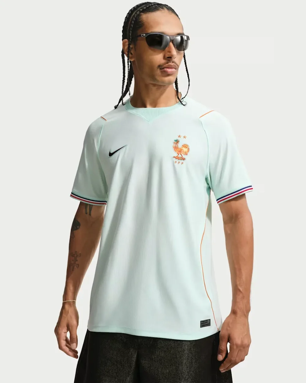 France Away jersey 2026 Delivery Rwanda Front view of a model wearing the authentic light mint-green Nike France 2026 away stadium football jersey with tricolor cuffs — Premium Sportswear Delivery Rwanda.