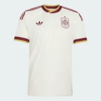 Spain_26_Away_Jersey_White_JN4397_01_laydown ront flat-lay view of the Adidas Spain 2026 away football jersey in cream with lavender and gold accents — Premium Sportswear Delivery Rwanda.