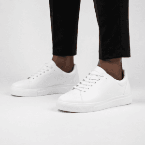 white Zara men's minimalist low-top court sneaker in smooth leather with matching white laces and a thick rubber sole — Casual Men's Designer Footwear Rwanda.