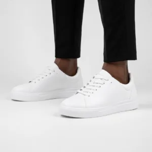 white Zara men's minimalist low-top court sneaker in smooth leather with matching white laces and a thick rubber sole — Casual Men's Designer Footwear Rwanda.