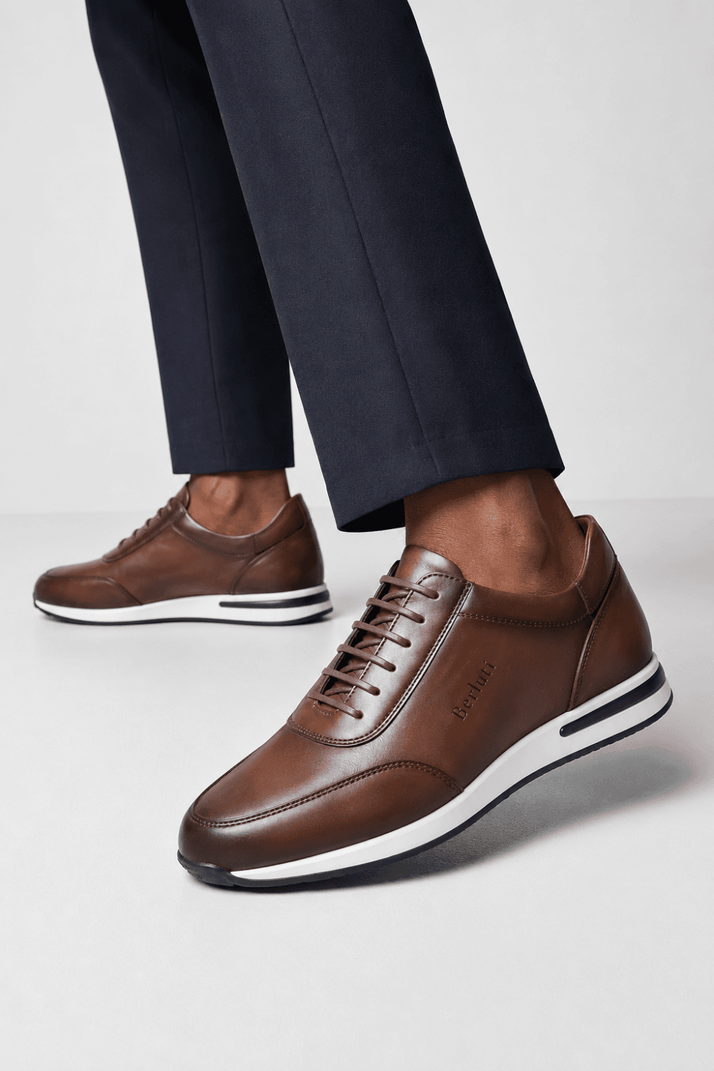 6b75060d-703b-47c9-91d2-e17ccc73f978 Premium brown lace-up sneakers for men, available at Tsapa Rwanda.