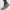 a man in Grey leather apron-toe moccasin loafers for men with crest emblem