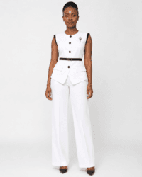 Women’s White Sleeveless Peplum Pantsuit Woman wearing a white sleeveless peplum pantsuit with black trim and wide-leg trousers