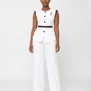 Woman wearing a white sleeveless peplum pantsuit with black trim and wide-leg trousers