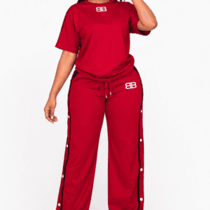 Woman wearing a red T-shirt and wide-leg side-snap track pants set