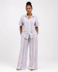 Woman wearing a pastel vertical-striped shirt and wide-leg trouser two-piece set