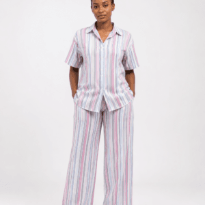 Woman wearing a pastel vertical-striped shirt and wide-leg trouser two-piece set