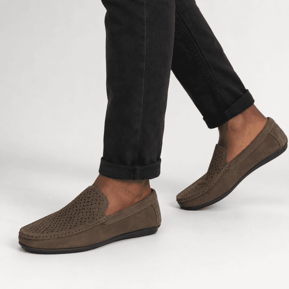 man in Taupe perforated suede moccasin loafers for men with black sole Taupe Perforated Suede Moccasin Loafers for Men