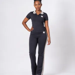 Full-length front view of model wearing camel black short-sleeve polo shirt and side-stripe track pants two-piece set — Women's Fashion Rwanda.