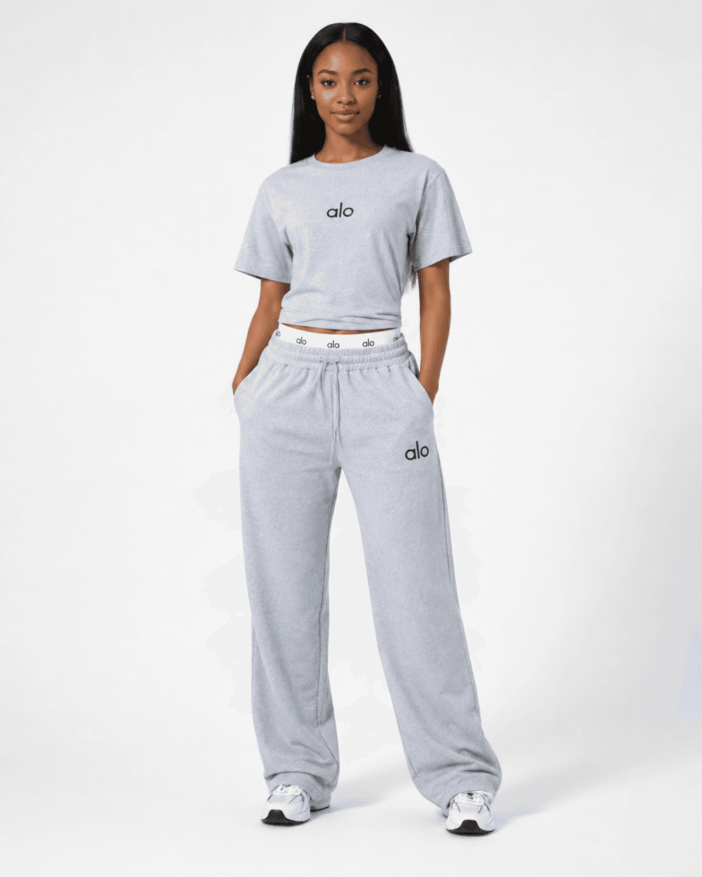 Full-length studio view of model wearing alo heather light grey cropped t-shirt and wide-leg sweatpants two-piece set with logo waistband — Women's Fashion Rwanda.