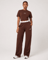 Full-length studio view of model wearing alo chocolate brown cropped t-shirt and wide-leg sweatpants two-piece set — Women's Fashion Rwanda.
