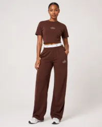 Full-length studio view of model wearing alo chocolate brown cropped t-shirt and wide-leg sweatpants two-piece set — Women's Fashion Rwanda.