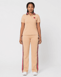 Full-length front view of model wearing camel beige short-sleeve polo shirt and side-stripe track pants two-piece set — Women's Fashion Rwanda.