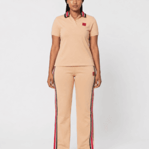 Full-length front view of model wearing camel beige short-sleeve polo shirt and side-stripe track pants two-piece set — Women's Fashion Rwanda.