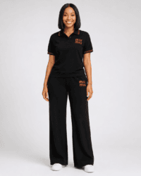 Full-length studio view of model wearing black short-sleeve MIU MIU shirt and wide-leg trousers two-piece set with red contrast trim and logo branding — Women's Fashion Rwanda.