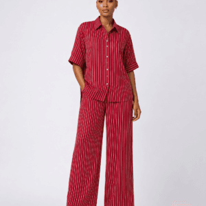 Full-length studio view of model wearing burgundy red pinstripe short-sleeve shirt and wide-leg trousers set — Women's Fashion Rwanda.